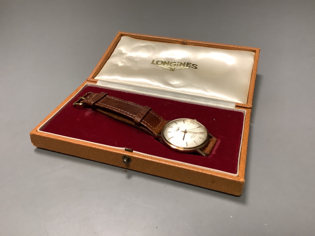 A gentleman's 9ct gold Longines Flagship automatic wristwatch, on a leather strap, with Longines box, case diameter 36mm, excluding crown, gross 36.8 grams.